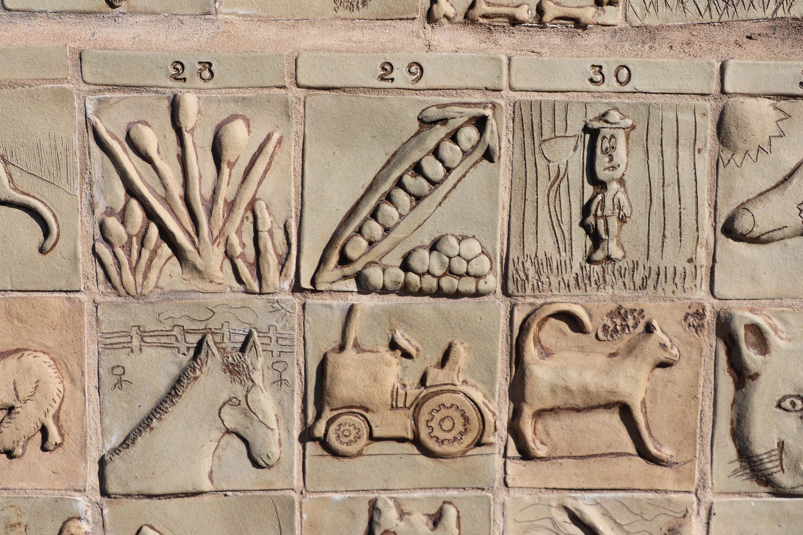 A photo of the tile project on the exterior wall of the Monroe Historical Society and Museum.